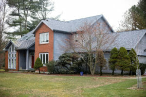 Home in New York with asphalt shingle roof